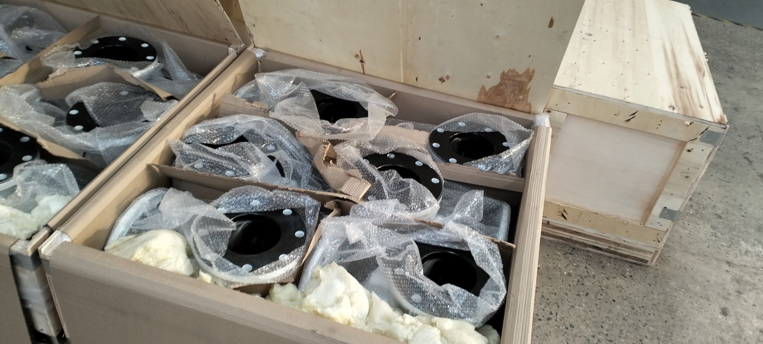 A collection of industrial diaphragm valves ready for shipping.