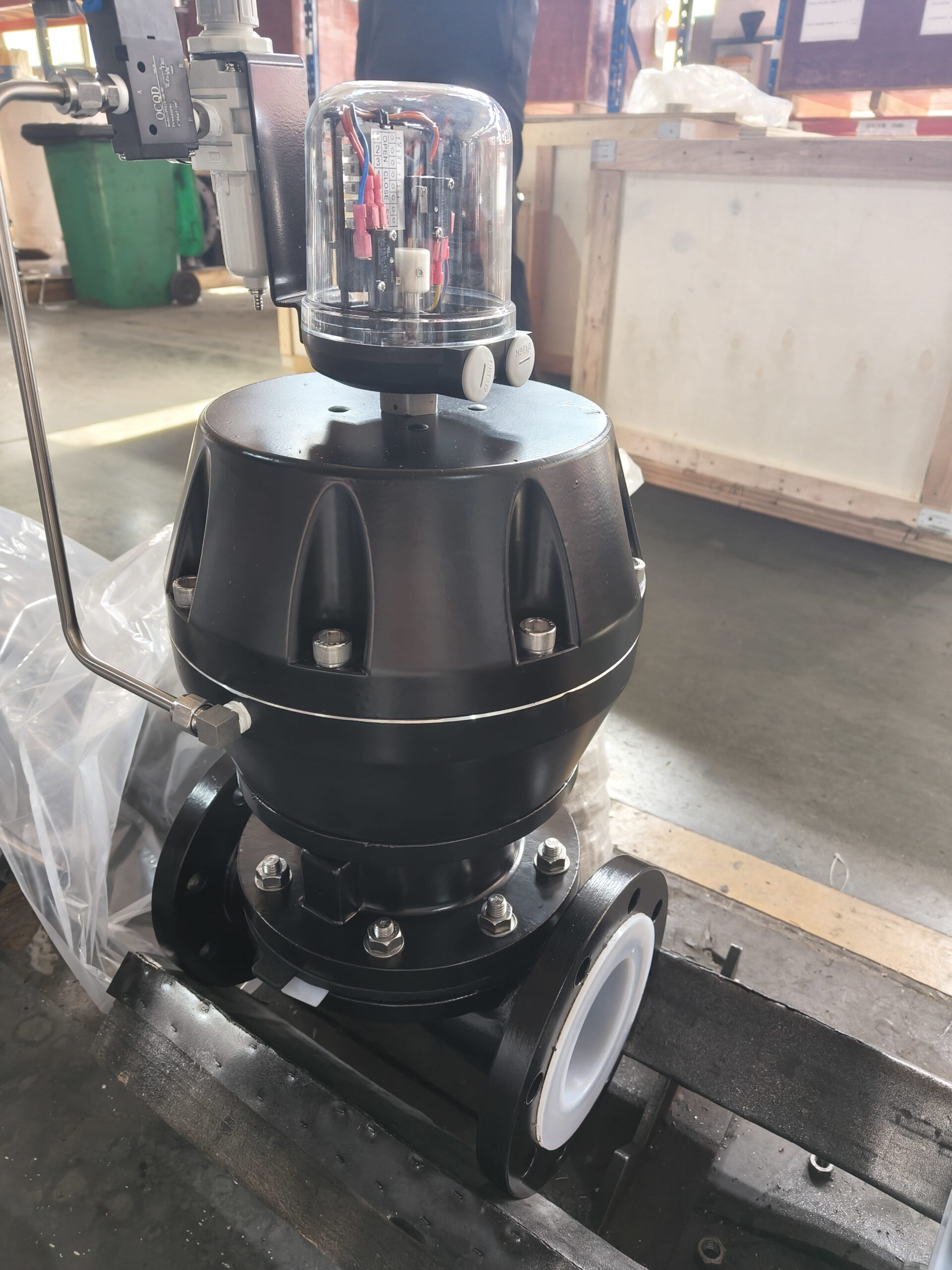 A large manual diaphragm valve in a power plant's water treatment system.