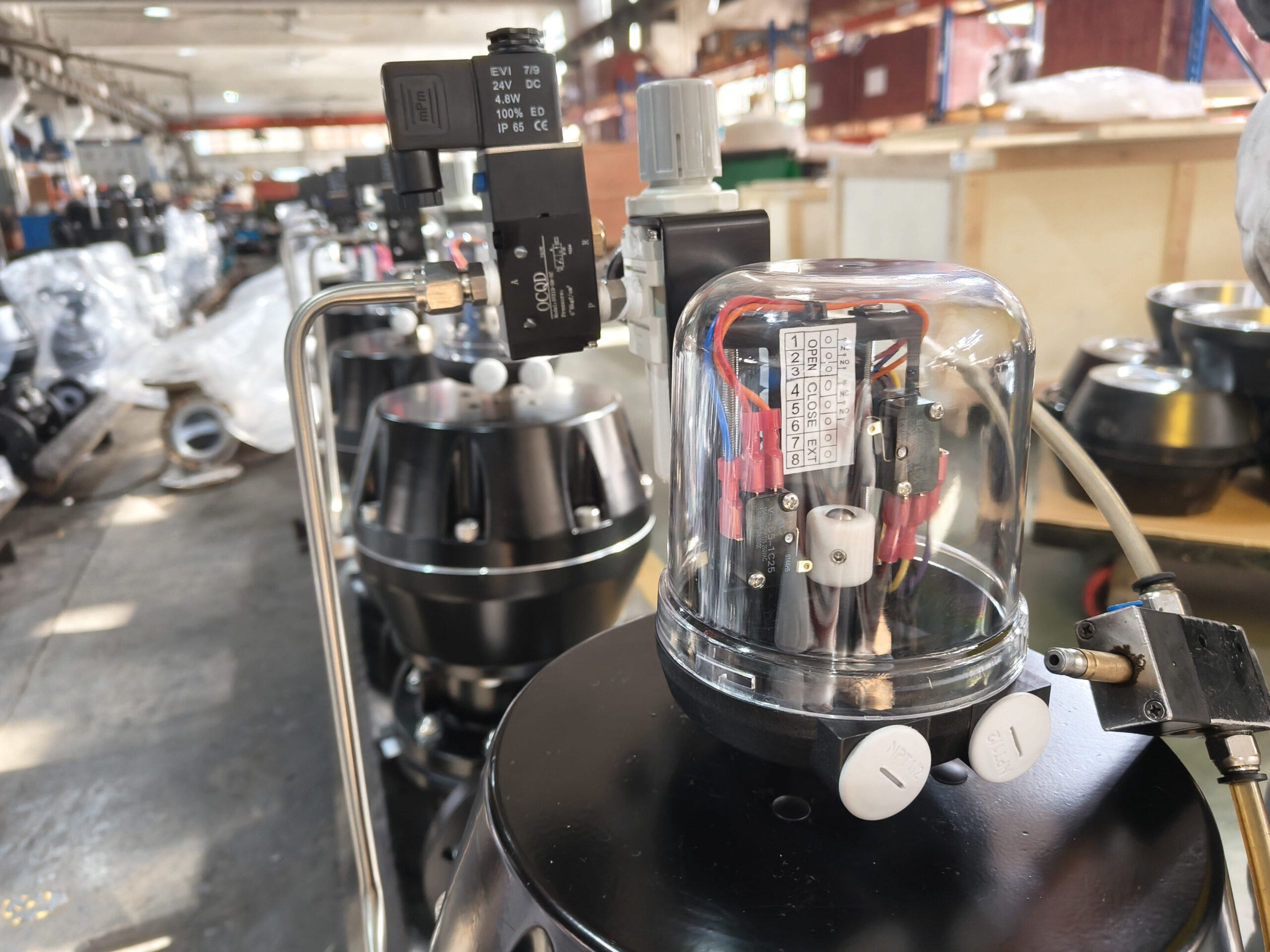 An engineer inspecting a diaphragm valve in a pipeline